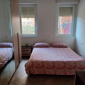 Postel nebo postele na pokoji v ubytování Appartamento 9 residance piviere + 2 fotografie