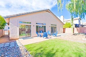 a house with blue chairs on a patio at Catalina Serenity Paradise in Tucson