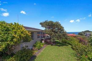 a house with a view of the ocean at Amongst the Action - Te Kaha in Te Kaha