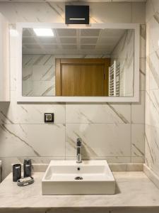 a white sink in a bathroom with a mirror at Luxury home in Istanbul's Golden Horn in Istanbul