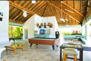 a living room with a pool table in it at Richmond Estate With Pool House in Ocho Rios