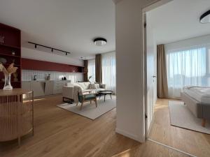 een woonkamer met een keuken en een woonkamer met een bed bij Klingerka brand new 1-bedroom apartment free parking in Nivy
