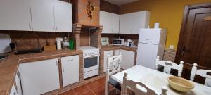 Kuchyň nebo kuchyňský kout v ubytování Apartamento Turistico "El Rincón de la Pernila"