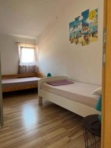 Postel nebo postele na pokoji v ubytování Vila Rosanda