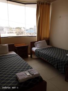 Voodi või voodid majutusasutuse Hostal Posada Del Sol toas