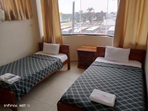 Voodi või voodid majutusasutuse Hostal Posada Del Sol toas