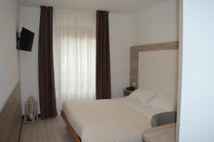 Posteľ alebo postele v izbe v ubytovaní Albergo Ristorante Da Neni