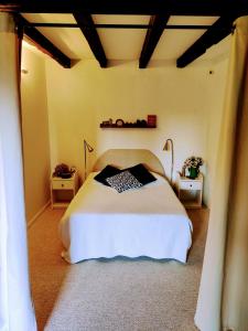 A bed or beds in a room at Ferme de Chamonal