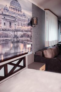 a living room with a wall mural of a bridge at Вілла Aqua Shayan in Shaian