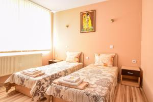 Ένα ή περισσότερα κρεβάτια σε δωμάτιο στο Mariana Apartment