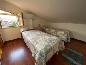 A bed or beds in a room at Villa indipendente le coccinelle beach mare piscina a 250 mt dal mare con servizio di piscina a 400 mt 12 k da Cefalu