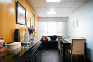 a living room with a couch and a table at Recoleta 1443 Boutique Apartments in Buenos Aires