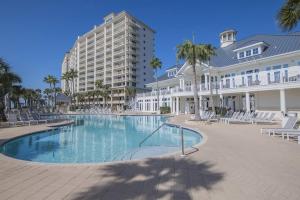 a large swimming pool in the middle of a resort at Beach Club C1001 Amazing Corner Unit in Gulf Shores