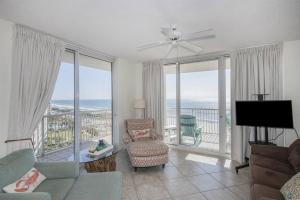 a living room with a view of the ocean at Beach Club C1001 Amazing Corner Unit in Gulf Shores