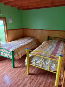 Voodi või voodid majutusasutuse Cabaña Rincón Verde toas +11 fotot