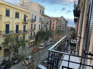 a view of a city street from a balcony at A casa da Carlo in Palermo