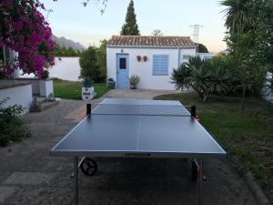 a ping pong table in front of a house at Villa Can Llompart Port de Pollensa in El Port