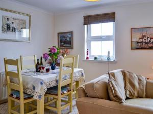 a living room with a table and a couch at Ocean View in Port William