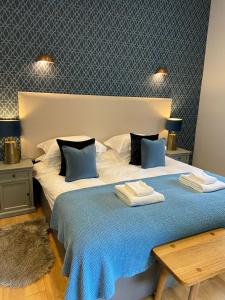 En eller flere senger på et rom på Yorkshire Dales Lodge 18 Premium Family