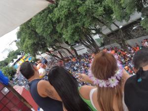 a group of people standing in a crowd at a parade at Hotel Plaza Campo Grande in Salvador +21 photos