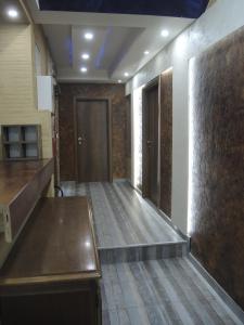 a hallway with a wooden floor and a door at Rooms&Restaurant 43 in Belgrade