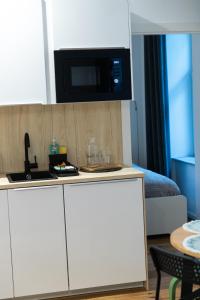 Kuchyň nebo kuchyňský kout v ubytování STILVOLLES APARTMENT