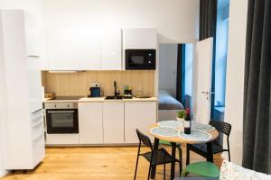 Kuchyň nebo kuchyňský kout v ubytování STILVOLLES APARTMENT