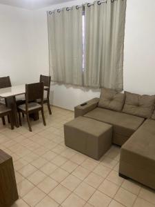 a living room with a couch and a table at Martin Quintanilha 1B in Goiânia