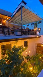 a view of a house with a deck at night at Penzion Panská in České Budějovice