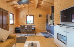 a living room with a dining room table in a cabin at Beautiful Home In Merzalben With Kitchen in Merzalben