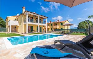 an image of a villa with a swimming pool at Stunning Home In Nedescina With Outdoor Swimming Pool in Nedeščina