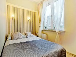 Posteľ alebo postele v izbe v ubytovaní Apartament Kameralny III na Starówce