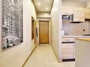 Kuchyňa alebo kuchynka v ubytovaní Apartament Kameralny III na Starówce