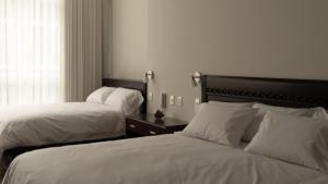Uma cama ou camas num quarto em LIMA HOST