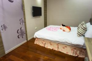 A television and/or entertainment centre at Bei Pin B&B