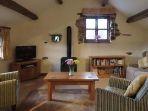 a living room with a coffee table and a window at Blencathra in Mungrisdale