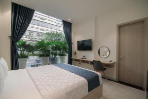 Tempat tidur dalam kamar di Bin Bin Hotel 8 - Near Sunrise City
