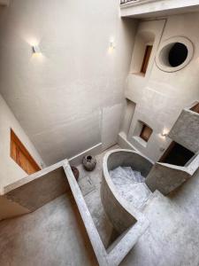 a bathroom with a tub in the middle of a room at Hotel Atia in Guadalajara +68 photos