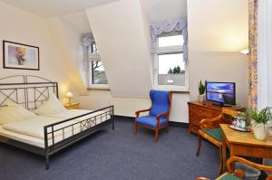 Postel nebo postele na pokoji v ubytování Hotel Haus Kleimann-Reuer