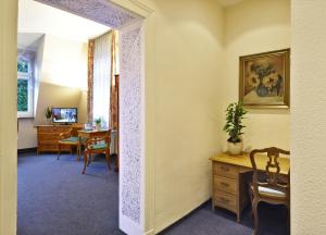 TV a/nebo společenská místnost v ubytování Hotel Haus Kleimann-Reuer