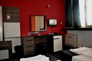 A bed or beds in a room at Hotel Dunav