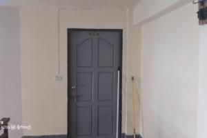 a door with a number on it in a room at Rooftop room in We Residence in Pattaya