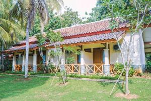 a house with a garden in front of it at INAGRO in Bogor