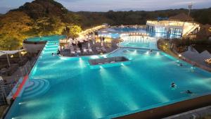an overhead view of a large swimming pool at night at Ecoland Hotel in Jeju