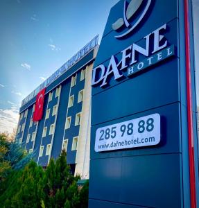 a sign in front of a dana hotel at Dafne Hotel in Ankara