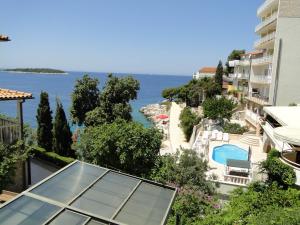 a view of the ocean from a building at Rooms Tepli Bok in Primošten