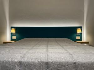 En eller flere senger på et rom på A10 Palazzo Marconi Apartment