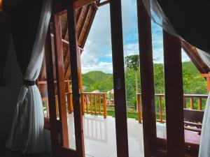 una vista desde la puerta del balcón de una casa en dbelish village & resto en batumadeg