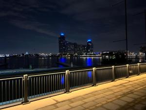 a view of a city skyline at night at Fabulous 1BHK Jadaf Water Front Near Metro Station in Dubai