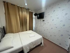 TV a/nebo společenská místnost v ubytování Hotel Aliff Tanjong Malim